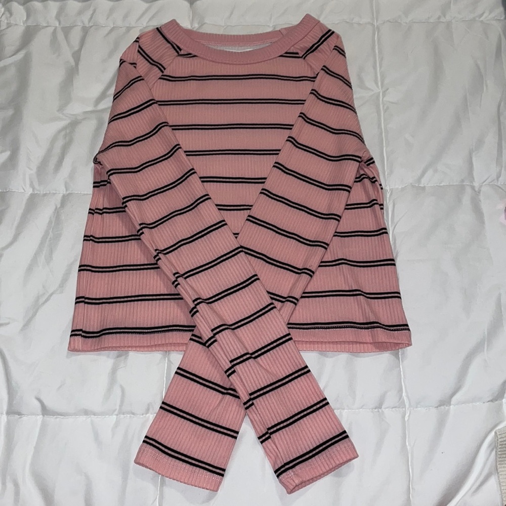 Pink long sleeve shirt with black stripes.
